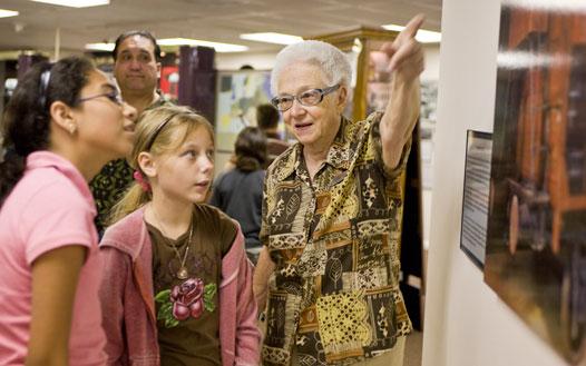 Lorie Mayer speaks with young visitors at the Holocaust Museum & Education Center of Southwest Florida.